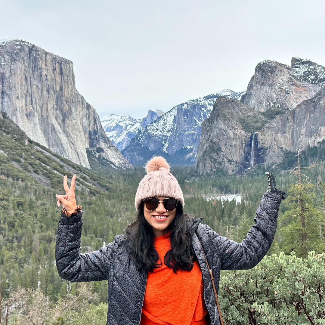 A grad student pictured in a mountainous region