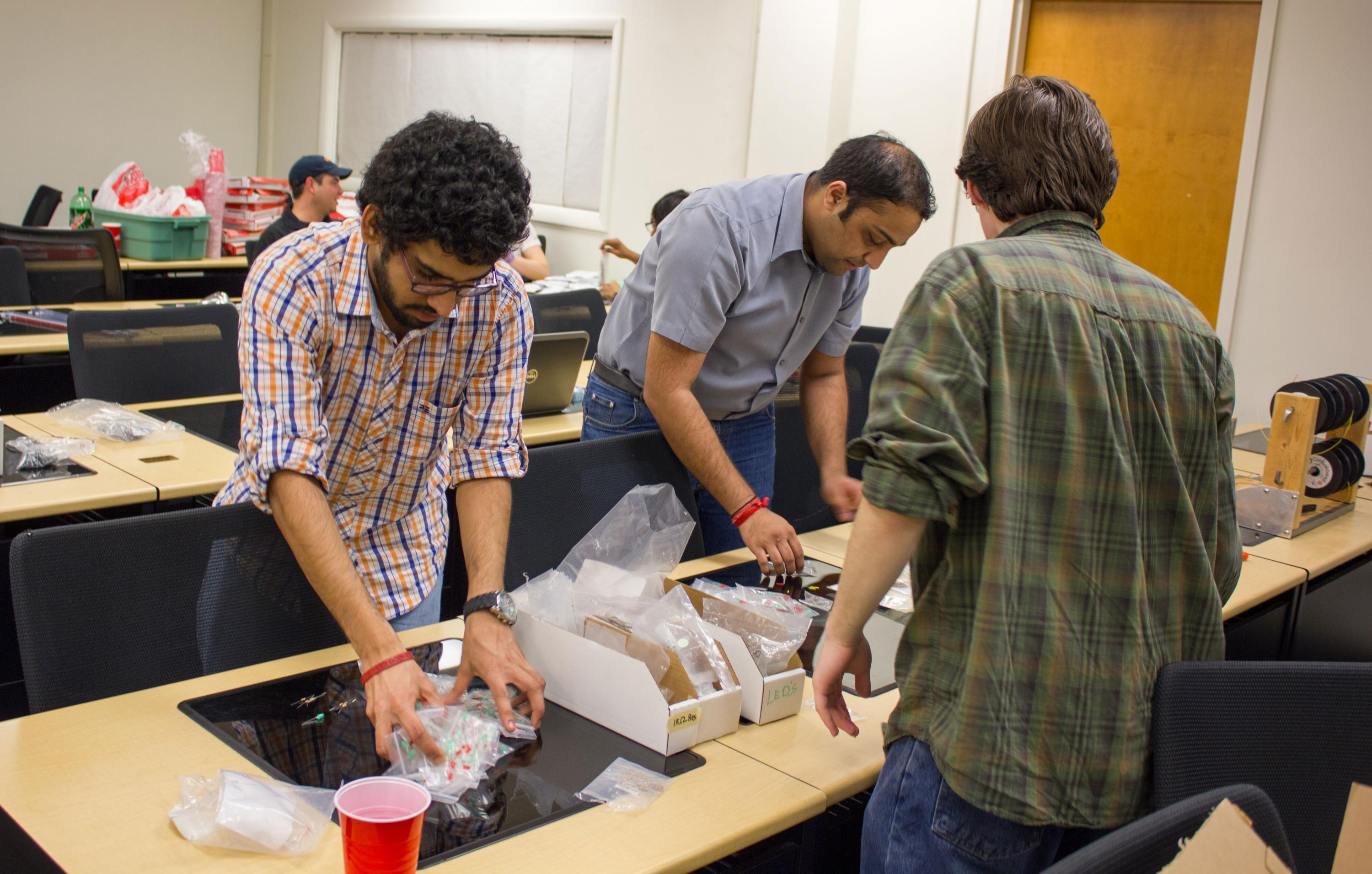 Eta Kappa Nu members assemble lab kits.