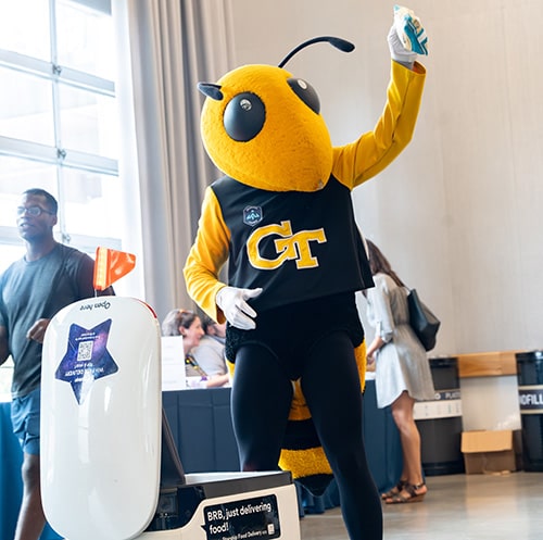 Buzz handing out food to students